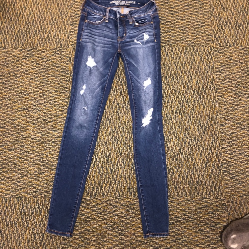 Acid washed ripped jeans